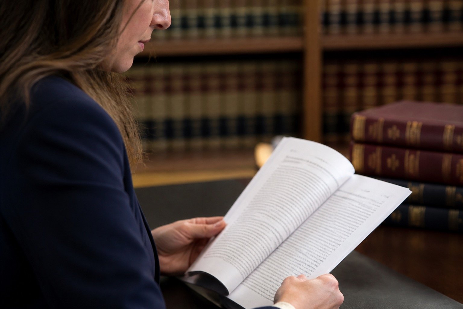 Legal researcher reading a decision from a close side angle