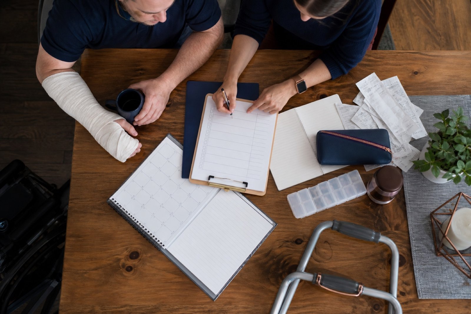 Expense receipts and a care plan viewed from above